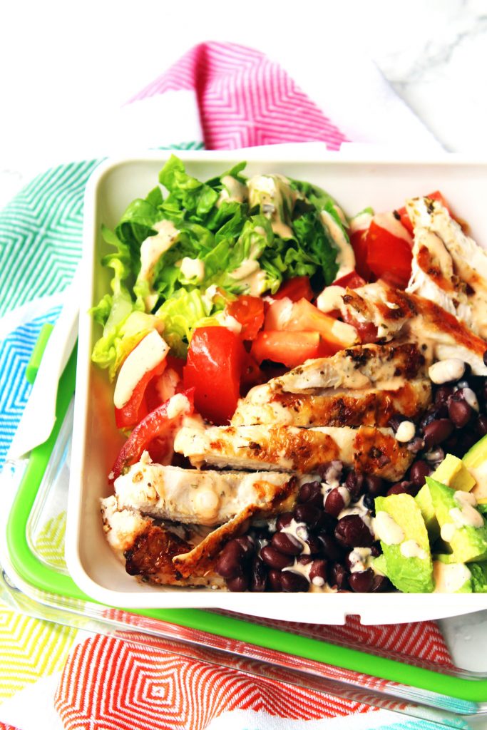 Chicken and Avocado Salad with protein rich black beans and a smokey buttermilk dressing. Healthy eating doesn't get better than this. Find the recipe at Supper in the Suburbs