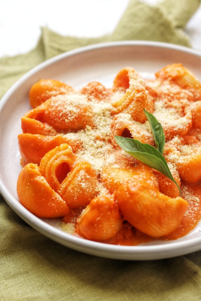 A plate of Lumaconi alla vodka with parmesan and basil
