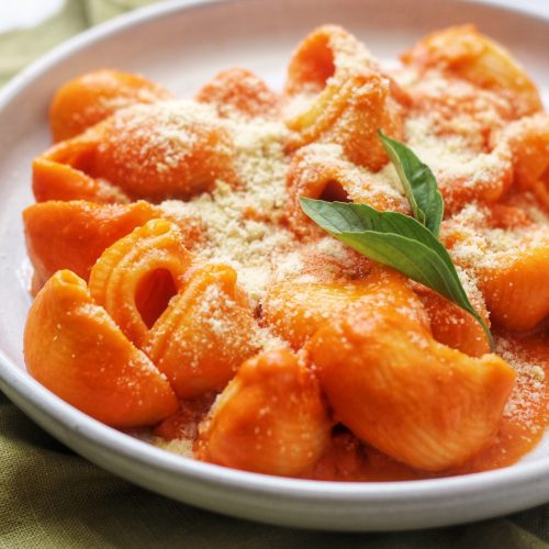 A plate of Lumaconi alla vodka with parmesan and basil