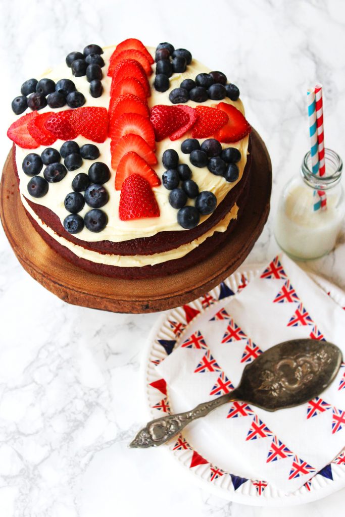 This Royal Red Velvet Layer Cake from Supper in the Suburbs is topped with Cream Cheese Forsting and Fresh Berries for a Union Jack Cake fit for a royal celebration. 