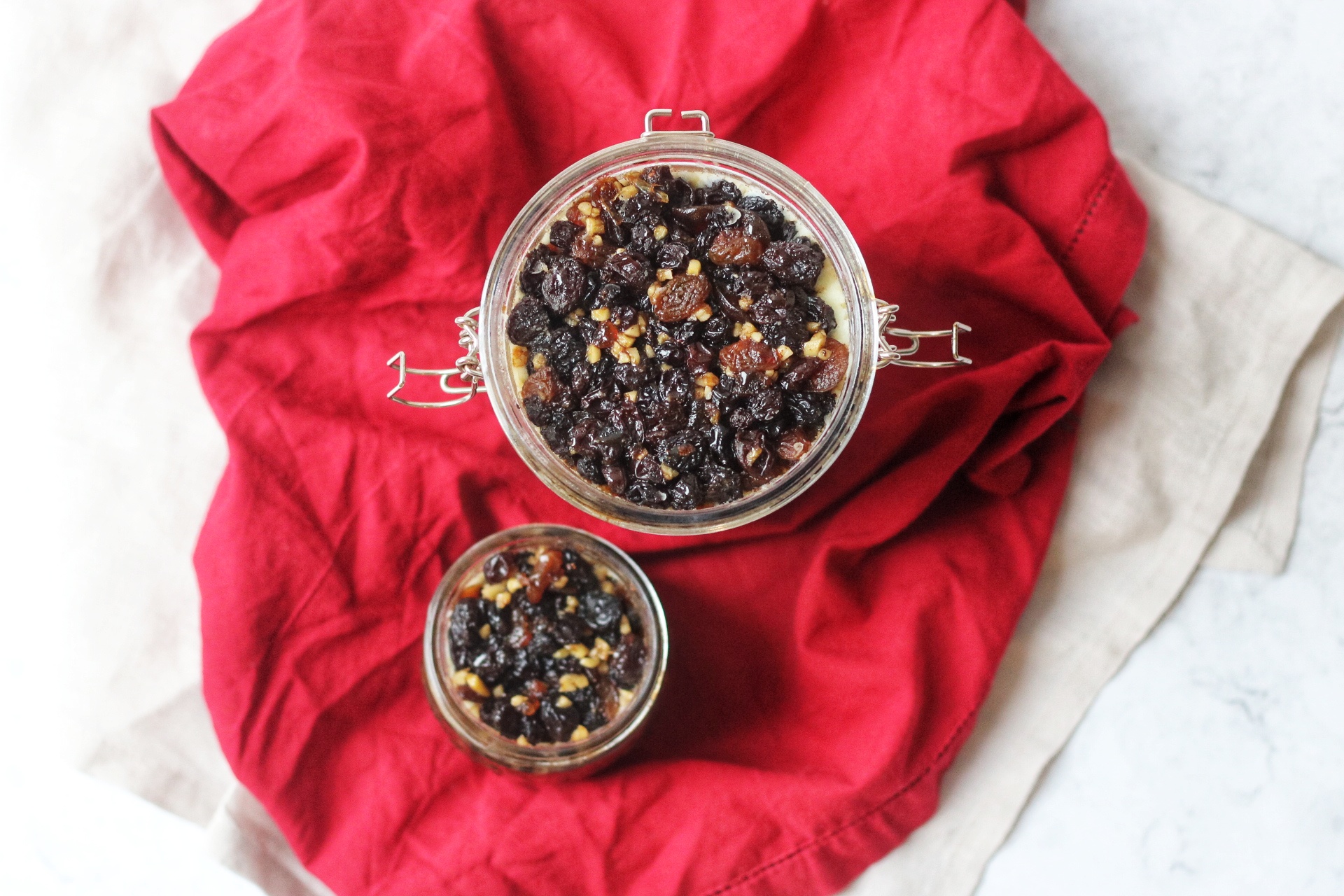 Overhead shot of two jars of mincemeat for making mince pies