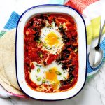 Spanish style Shakshuka with gooey egg yolks and flatbreads is made with green chillies and chorizo making it the perfect dish for breakfast,brunch, lunch or dinner.