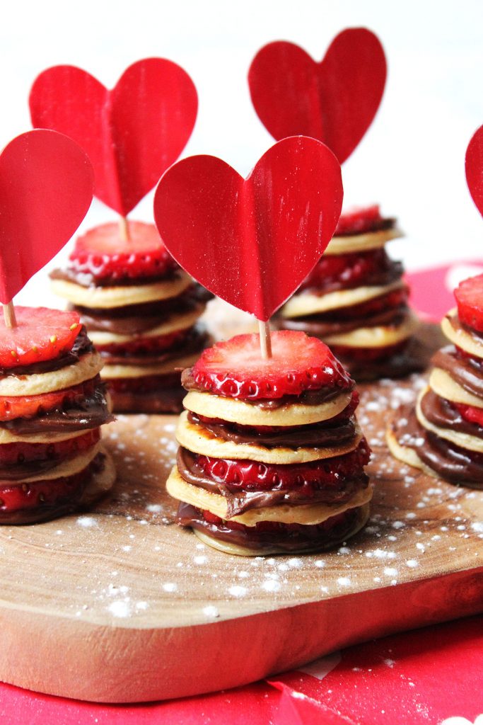 These Mini Nutella and Strawberry Pancake Stacks are perfect for pancake day, valentines day, a birthday treat or, just because! Get the recipe at Supper in the Suburbs