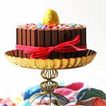 This over the top Chocolate Easter Cake is a real showstopped. Made with chocolate sponge, chocolate buttercream and covered in chocolate bars and candy it is a chocoholics dream. Get the recipe at Supper in the Suburbs!
