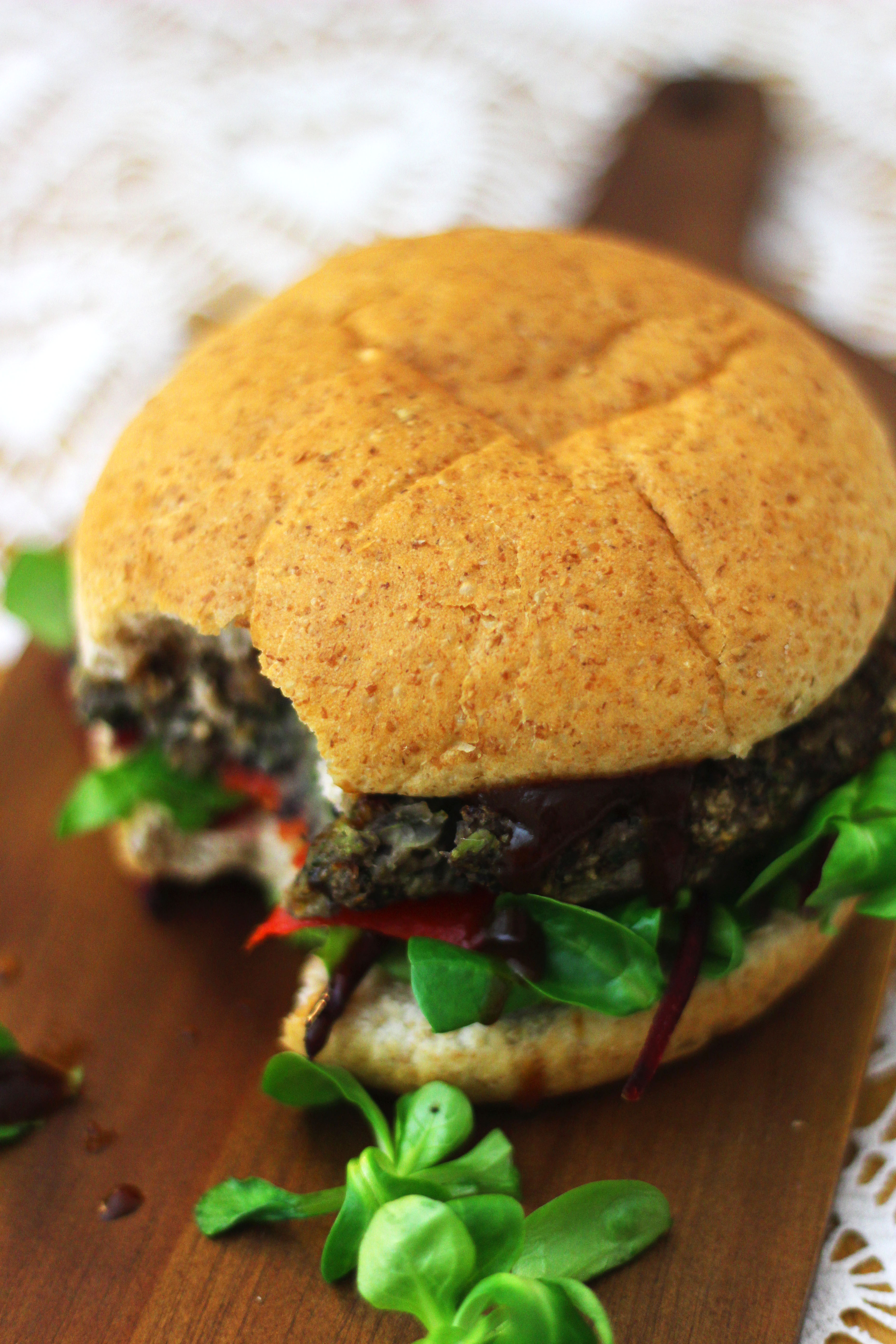 Take a bite out of this meaty BBQ Portobello Mushroom and Black Bean Burger despite how it looks this bad boy is 100 per cent meat free Find the recipe at Supper in the Suburbs