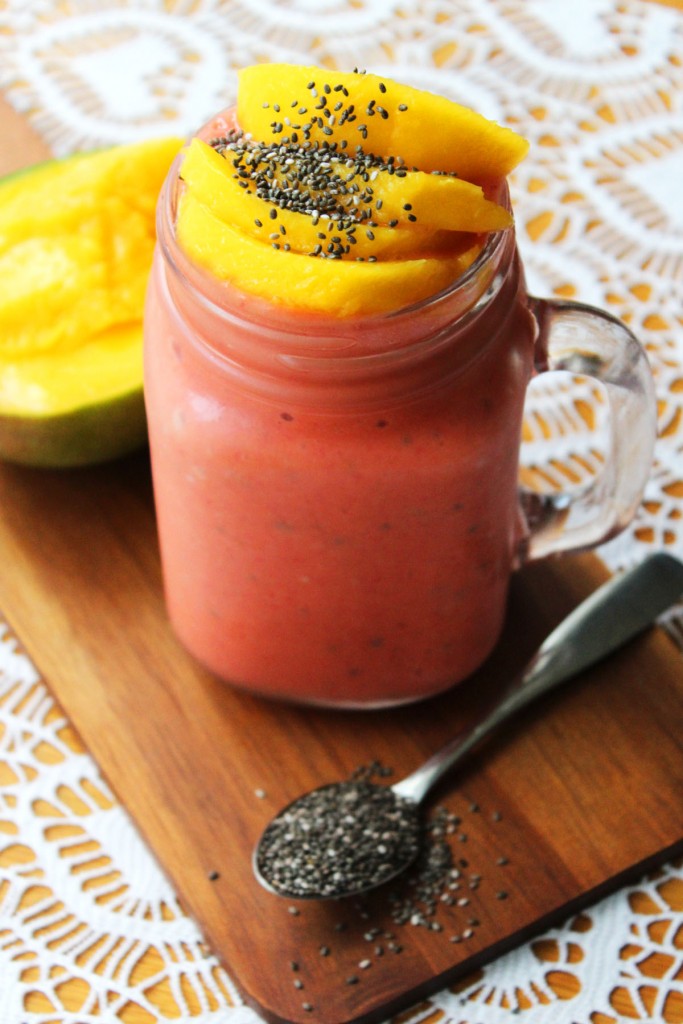This sunny Raspberry and Mango Smoothie with Chia Seeds is a great way to start the day find the recipe at Supper in the Suburbs