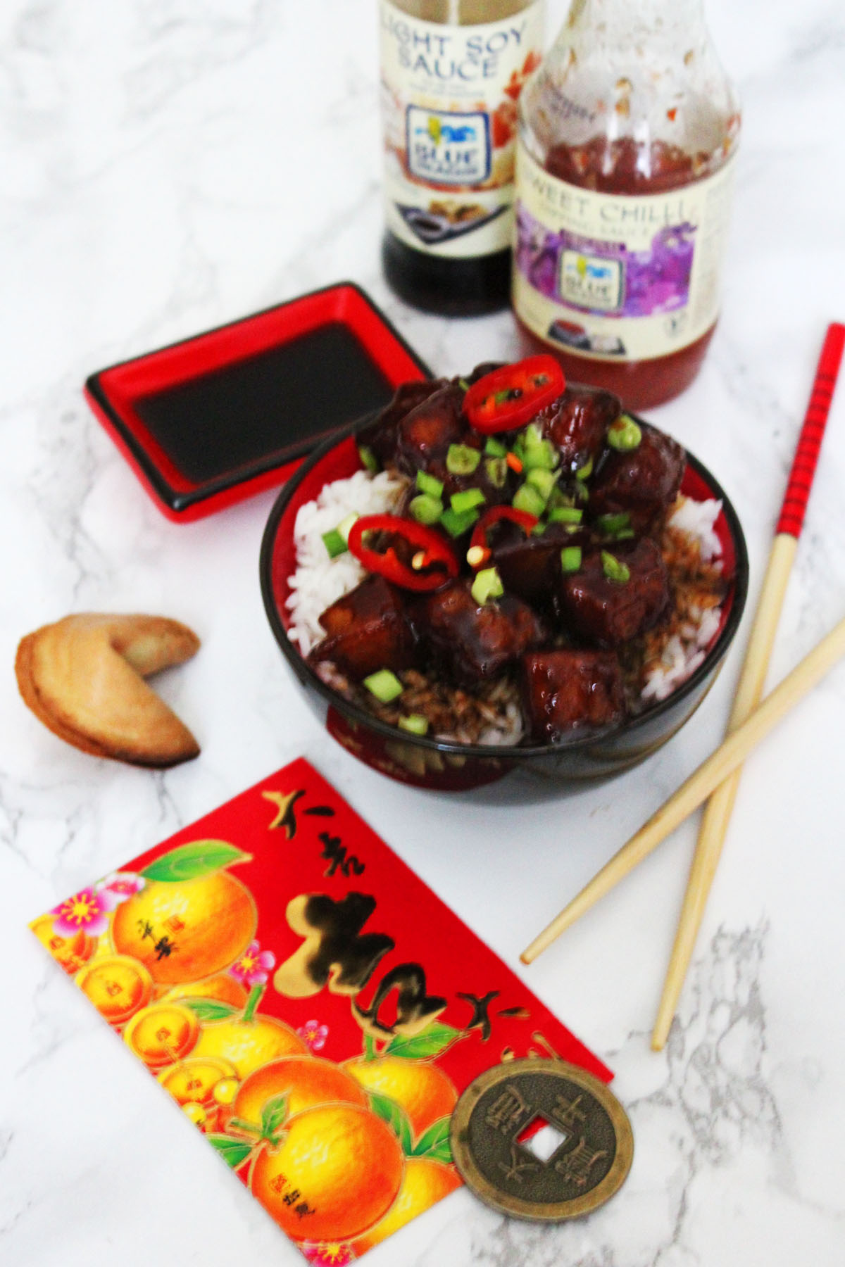 Celebrate Chinese New Year with Hong Shao Rou a Sweet and Spicy Pork Belly Dish served on steamed white rice