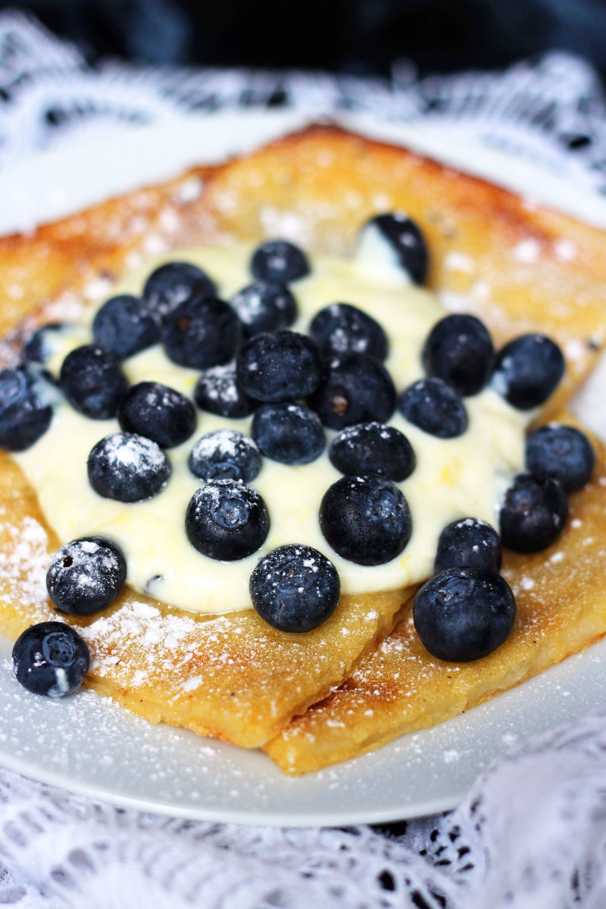 Oven Baked Pancakes are a traditional Scandinavian dish best served with yogurt and fresh blueberries