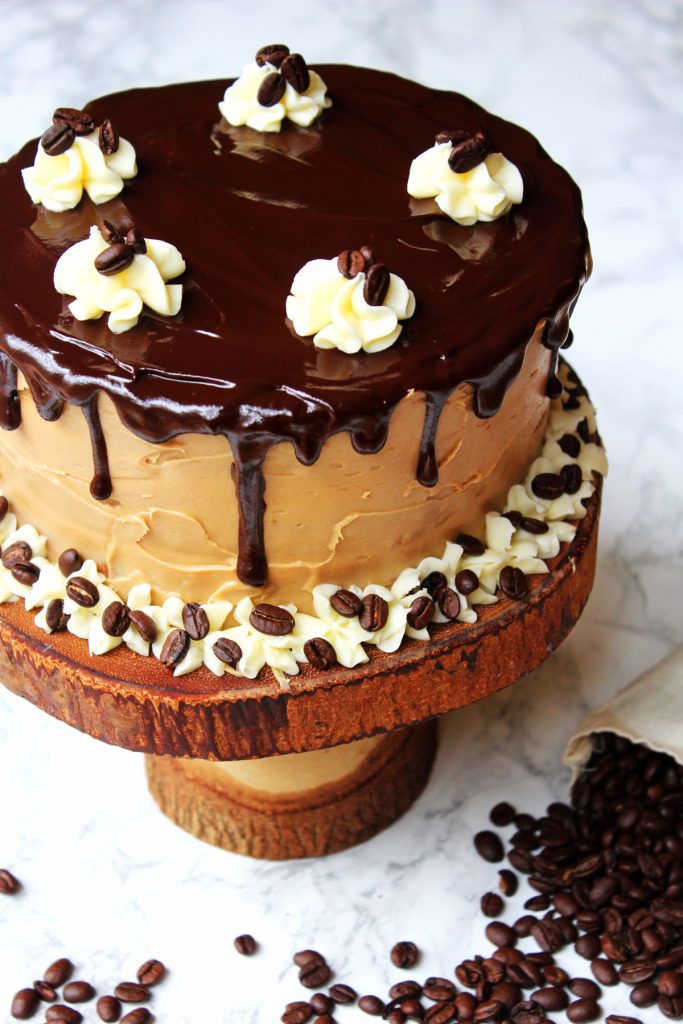 This Mocha Cake is perfect for a celebration! Made with layers of coffee cake, coffee buttercream and on trend chocolate ganache drips