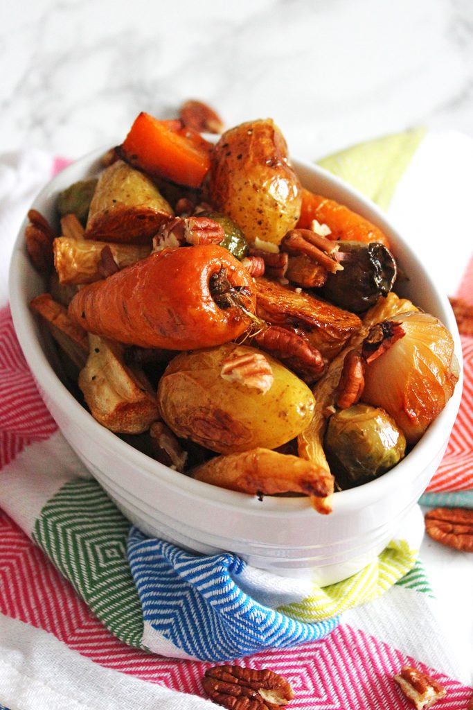 Maple roasted vegetables with pecan crunch are the perfect side dish for Thanksgiving, Christmas or your weekly roast dinner. Get the recipe for this simple on pot dish at Supper in the Suburbs!