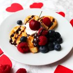 These heart shaped Vanilla Bean Waffles are the perfect Valentines Day breakfast or brunch! Top them with your favourite fruits, sauce and cream. You could even add sprinkles and nuts! Get the recipe on the blog.