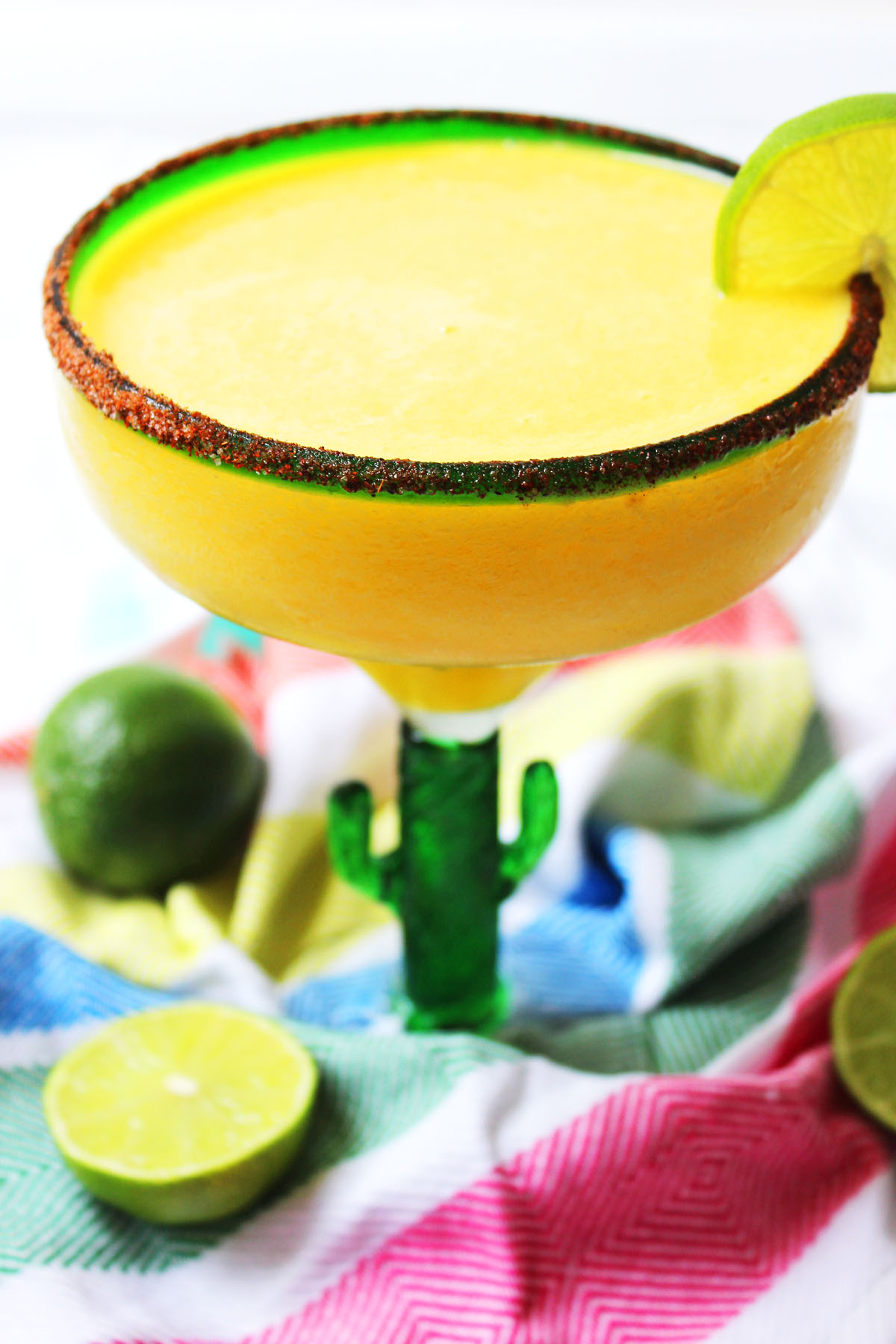This Frozen Mango Margarita is a fun twist on the classic Mexican cocktail. Perfect for Cinco De Mayo or a hot summer day! Fiesta! Get the recipe at Supper in the Suburbs!