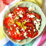 This delicious Tomato, Feta and Oregano Salad is inspired by holidays to Greece. Why not pack it for a picnic or serve it up at your next BBQ as a tasty side dish. Get the recipe at Supper in the Suburbs!