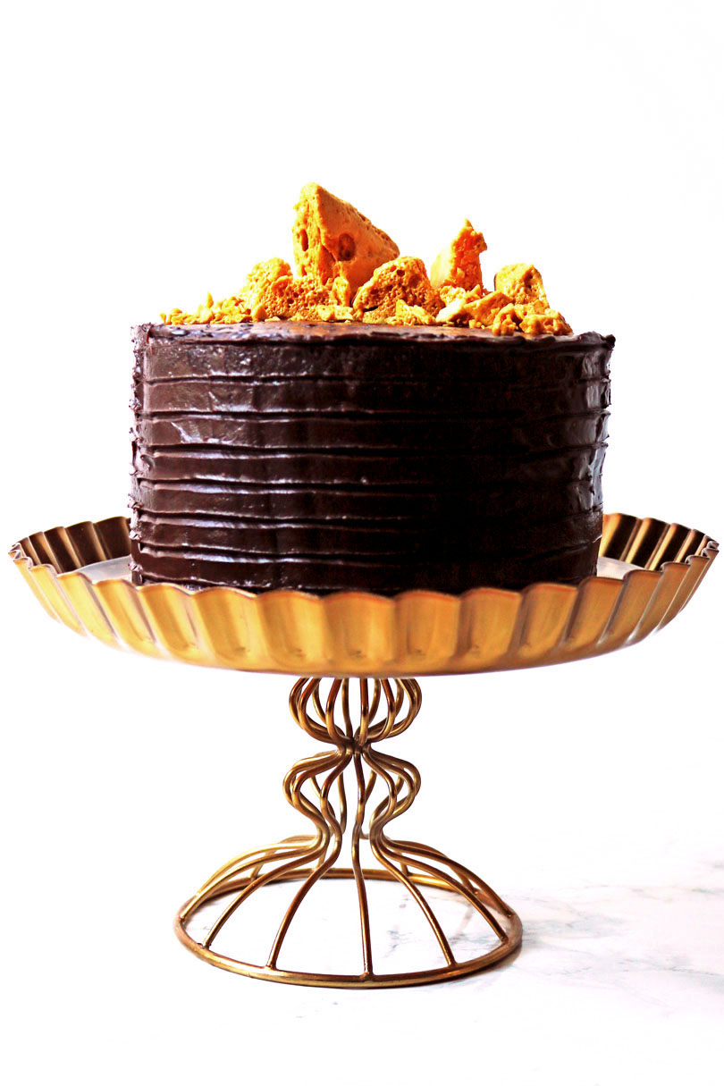 This Cinder Toffee Bonfire Cake is smothered in milk and dark chocolate ganache and topped with honey comb