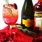 Cranberry and Aperol Sprtiz made with cranberry juice, aperol and prosecco.