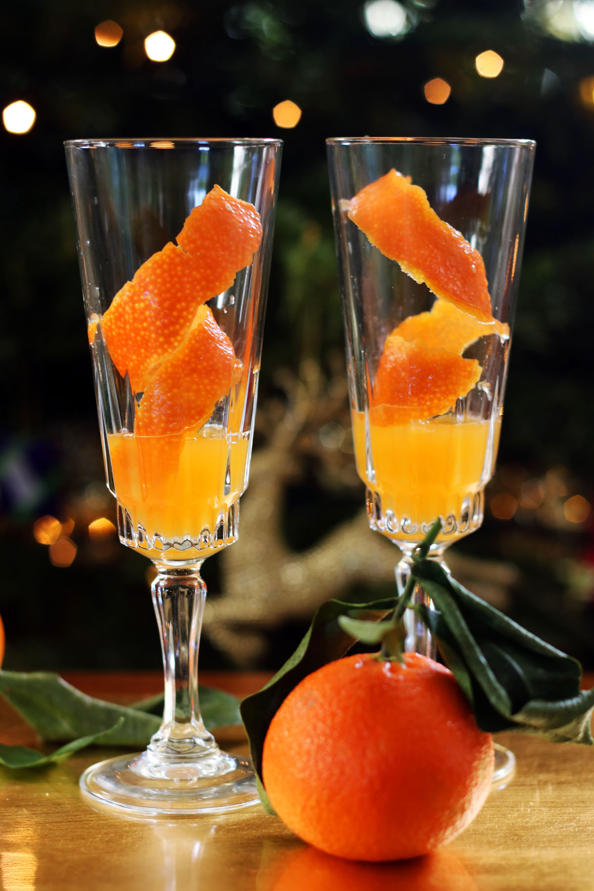 Celebrate the New Year with this delicious Clementine Mimosa, made with fresh clementine juice and prosecco. Get this festive brunch cocktail recipe at Supper in the Suburbs!