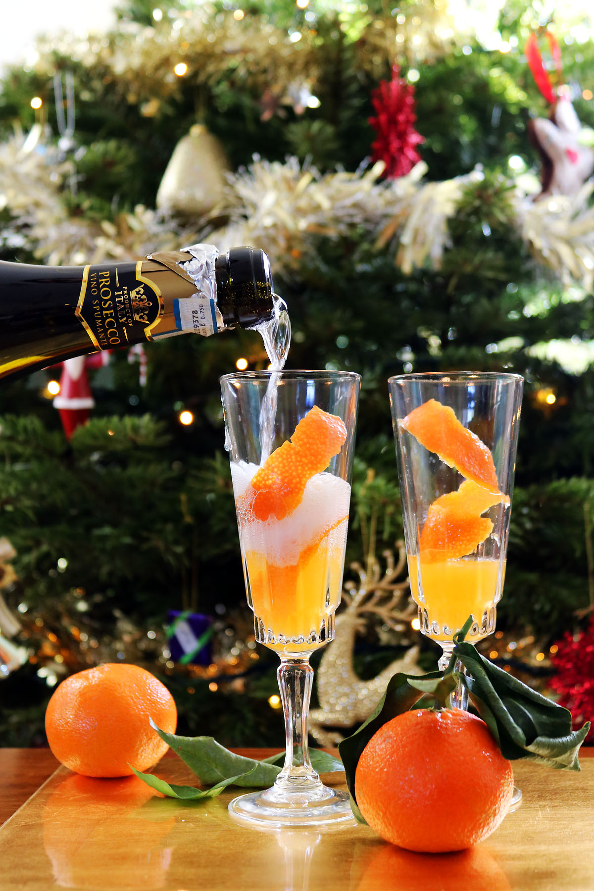 Prosecco poured over clementine juice is the perfect New Years Eve party cocktail or New Years Day brunch cocktail. Get the recipe at Supper in the Suburbs!