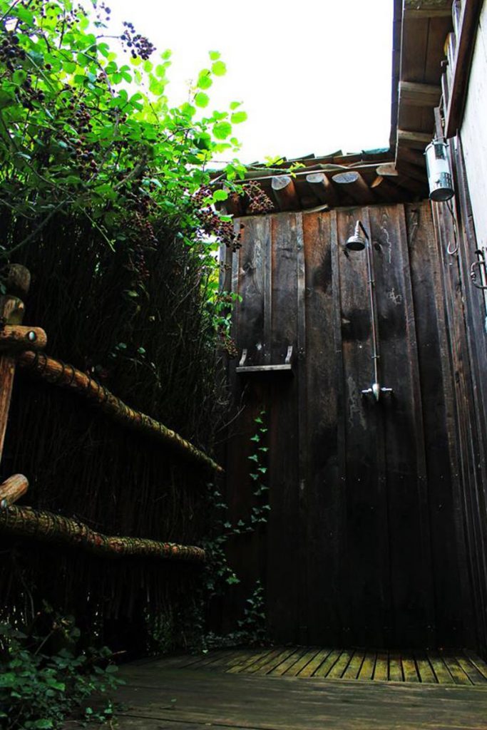 Showering outdoors is an experience not to miss while glamping off-grid