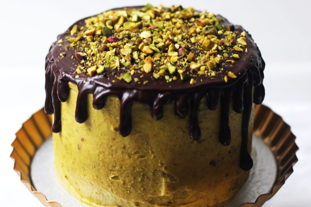 Dark chocolate pistachio layer cake with buttercream frosting.