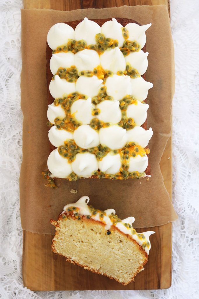 A slice of coconut and passion fruit loaf cake