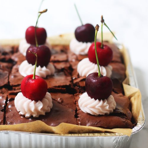 A tray of cherry and pecan brownies