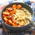 Creamy Porridge topped with Peach and almonds