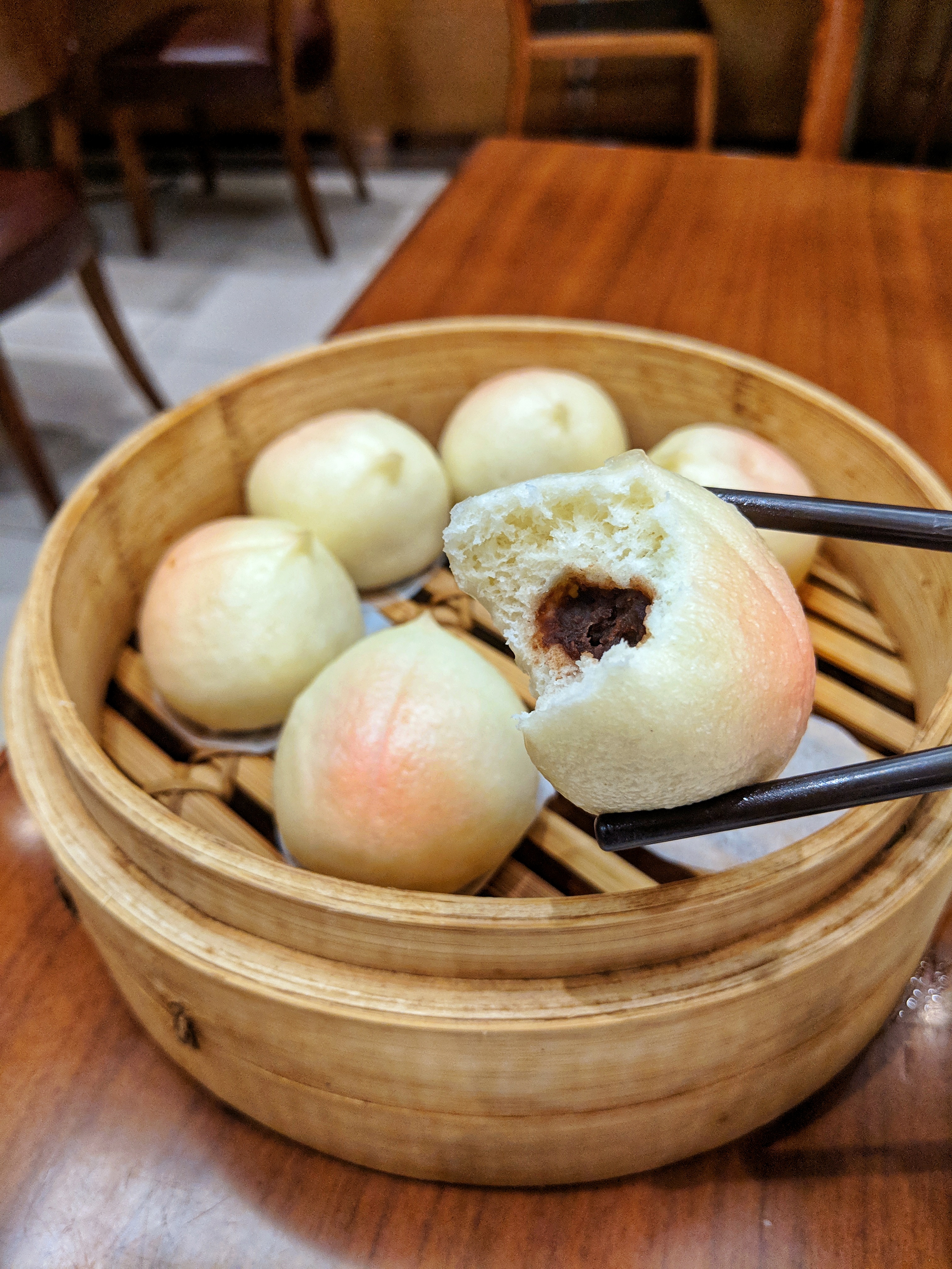 Steamed peach buns filled with red bean pasta from Din Tai Fung in Hong Kong