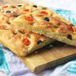 This classic focaccia recipe is flavoured with salty black olives, sweet cherry tomatoes and earthy rosemary