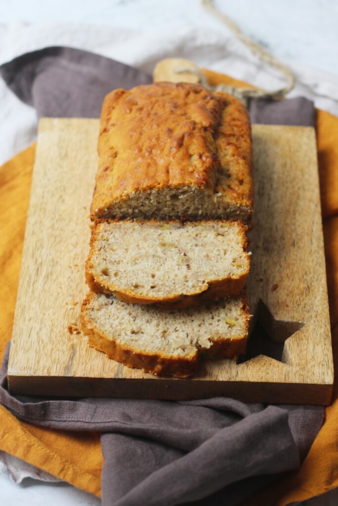 A loaf of Vegan Banana Bread cut into slices