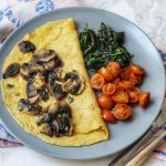 Savoury Vegan Crêpe topped with mushrooms, spinach and tomatoes