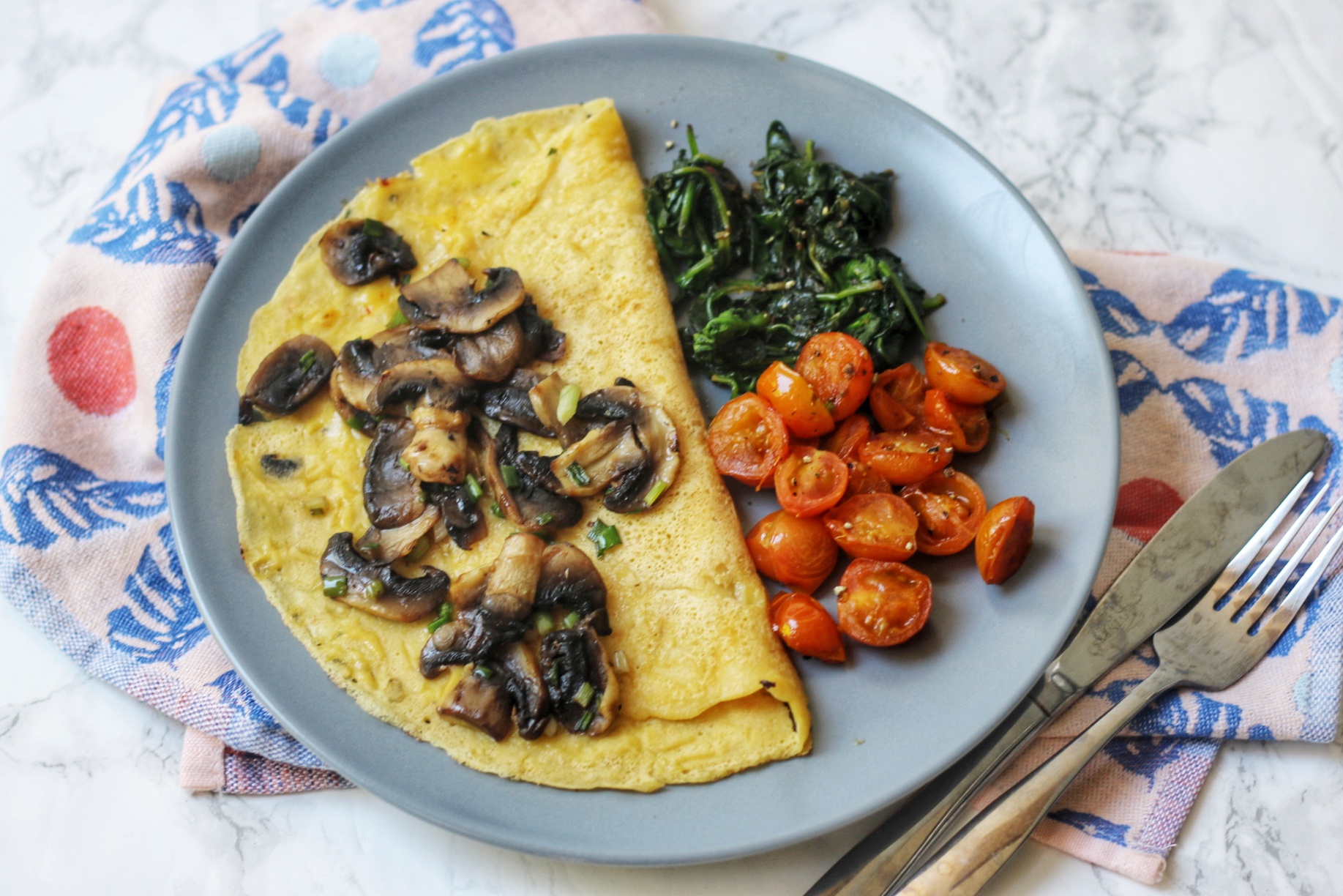 Savoury Vegan Crêpe topped with mushrooms, spinach and tomatoes