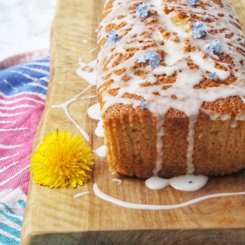 Vegan Lemon Drizzle Cake topped with flowers