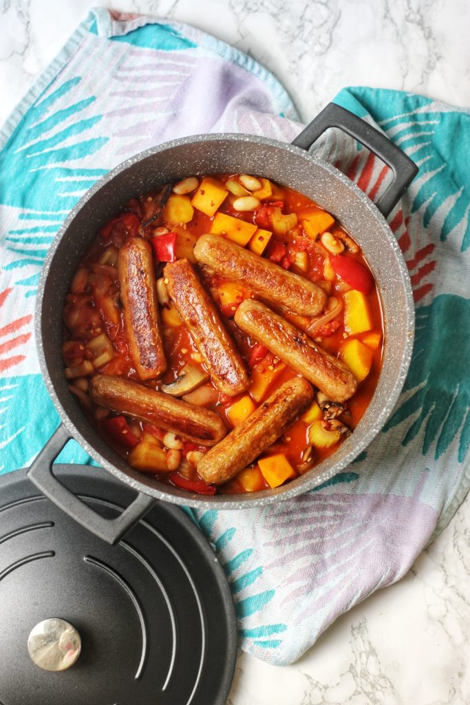 Vegan sausages in a spicy vegetable stew