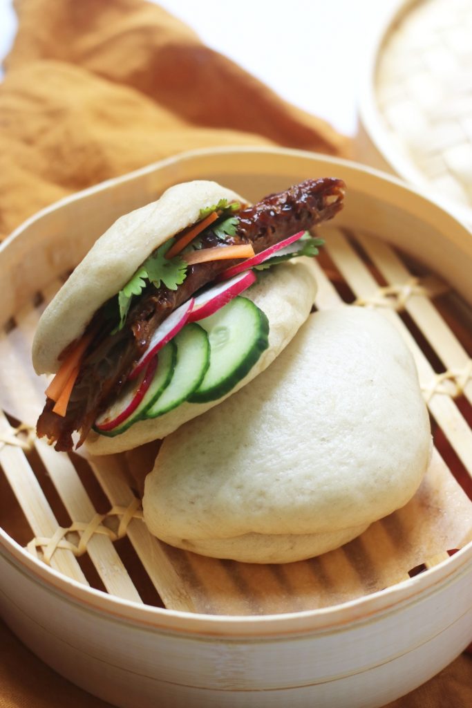 Vegan Steamed Bao Buns stuffed with plant based pork ribs