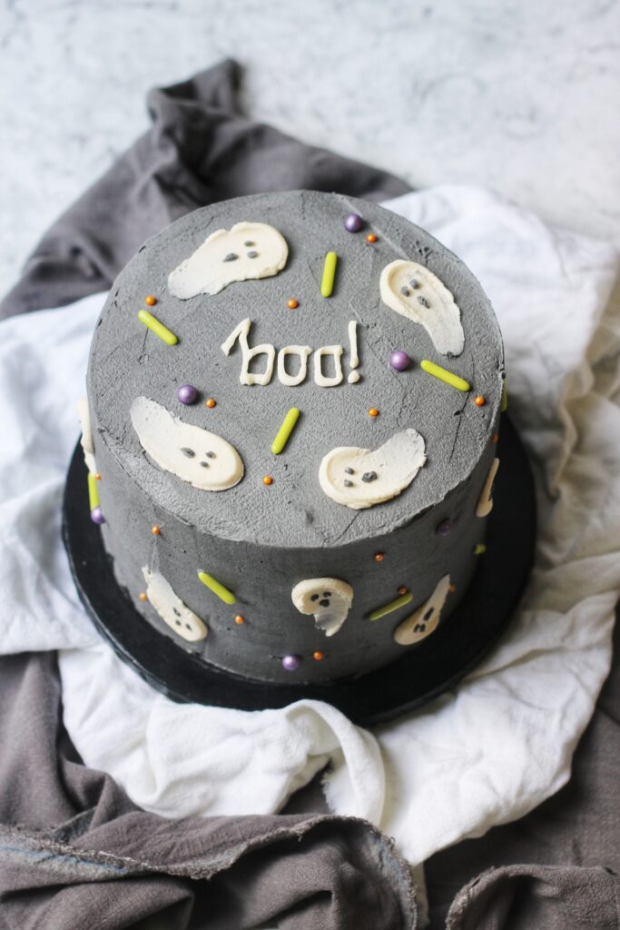 Red Velvet Halloween Cake with ghosts and sprinkles