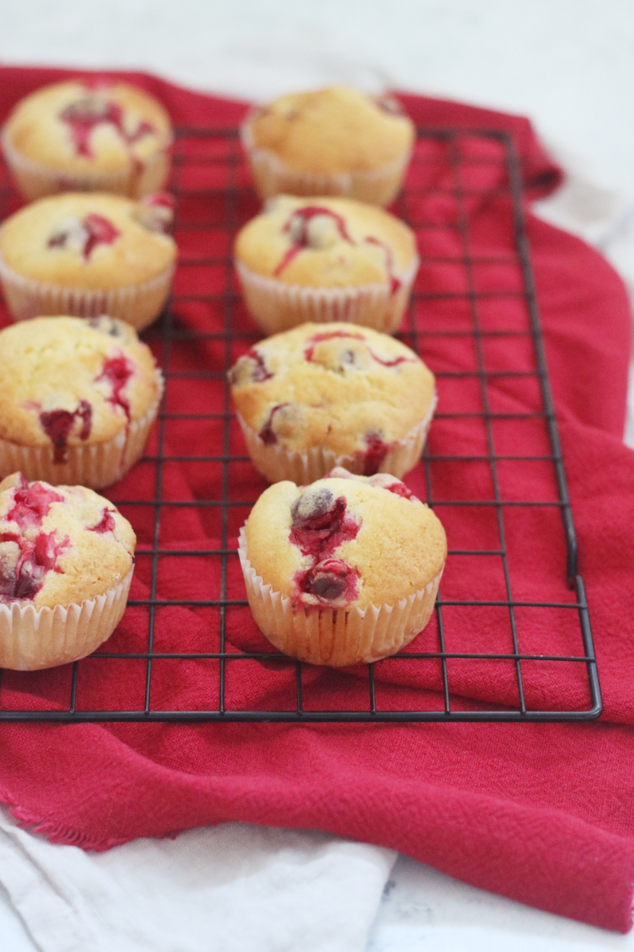 https://supperinthesuburbs.com/wp-content/uploads/2022/12/Vegan-Cranberry-Muffins-on-a-wire-rack-03.jpeg