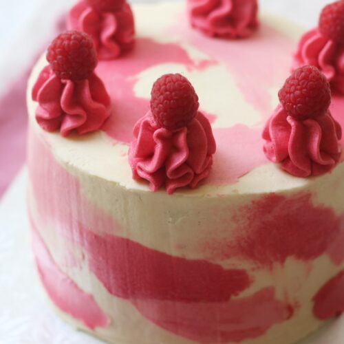 Vegan White Chocolate and Raspberry Cake decorated in a water colour style
