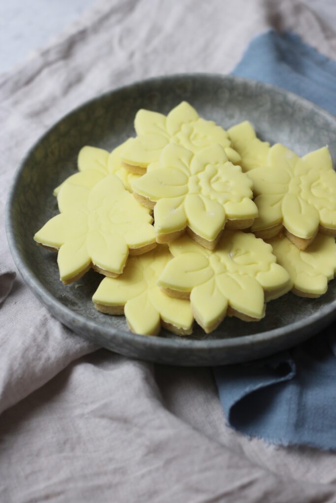 Vegan Lemon Sugar Cookies shaped like a daffodil