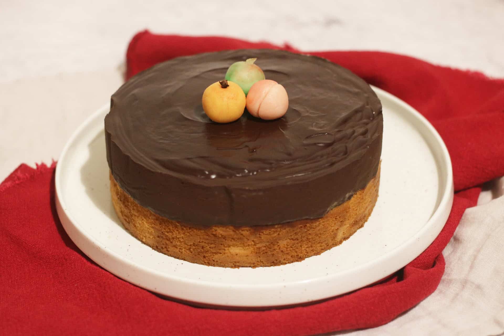 Vegan Tunis Cake decorated with homemade marzipan fruits