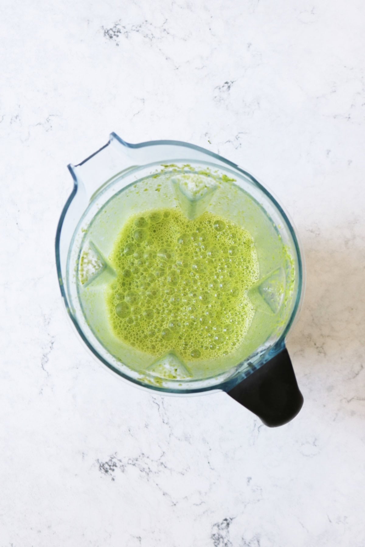 Bright green milk in a blender