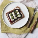 Vegan Beetroot Smørrebrød on a green napkin with a knife and fork