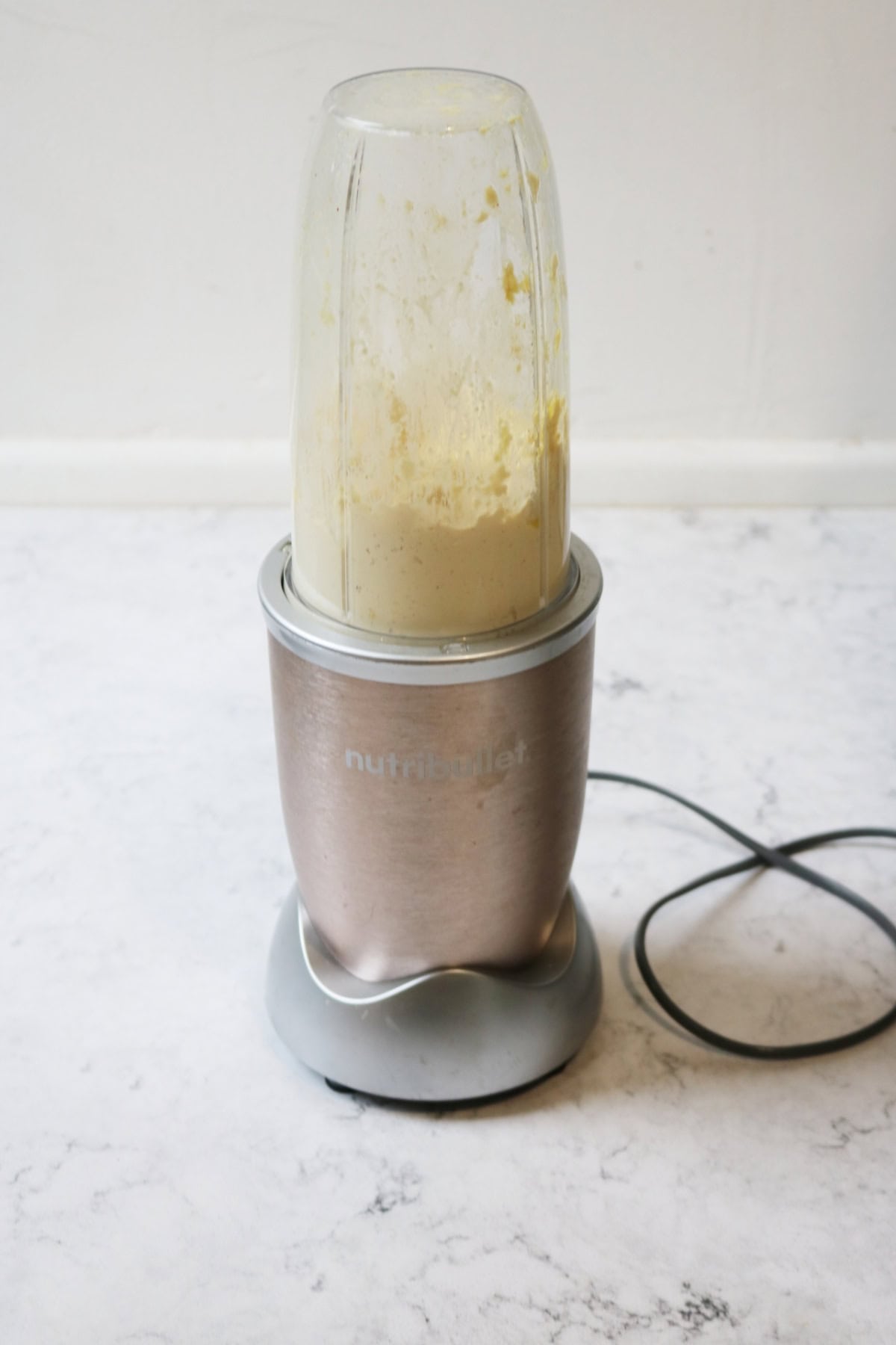 A nutribullet blending vegan ricotta