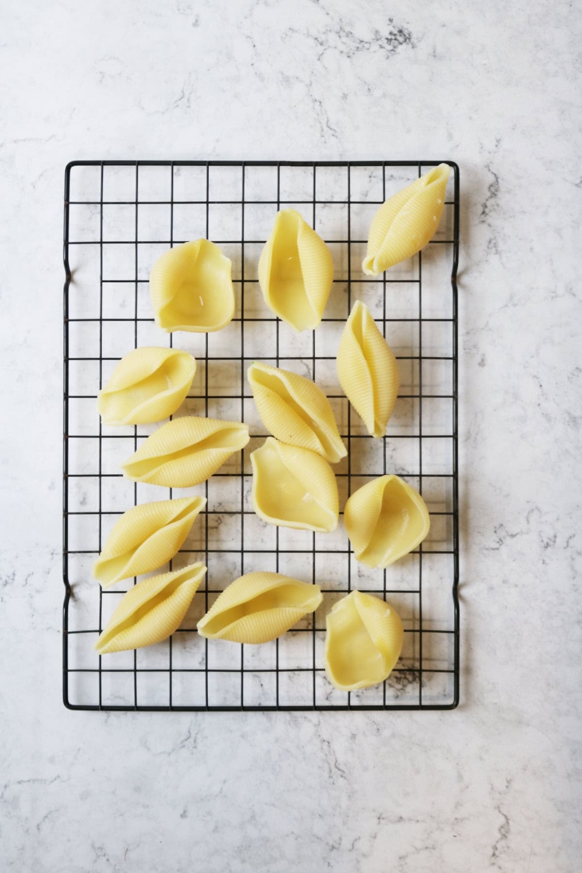 Jumbo pasta shells on a wire rack