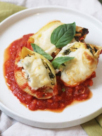 3 Vegan Spinach and Ricotta Stuffed Pasta Shells on a plate