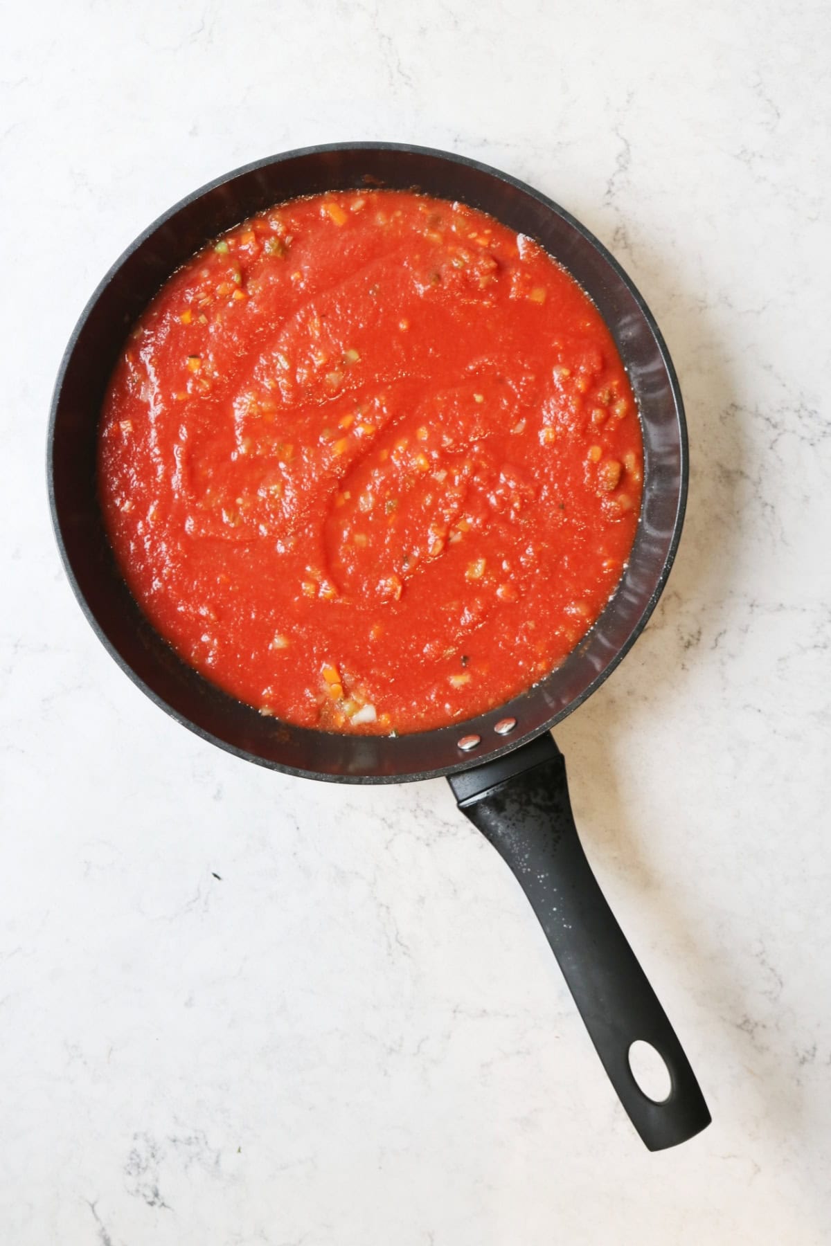 Tomato pasta sauce in a frying pan