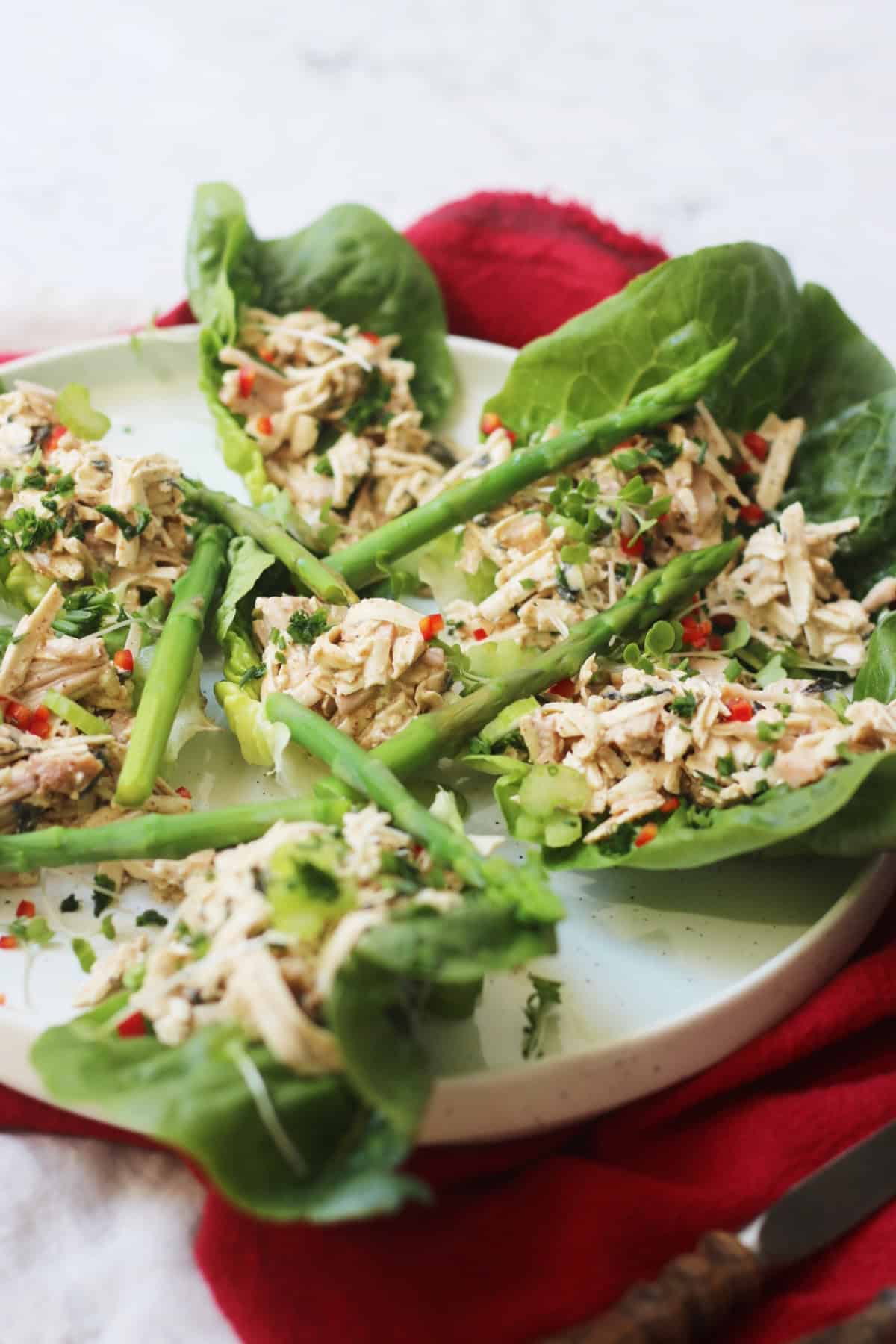 Vegan crab salad with asparagus and chilli served in lettuce cups