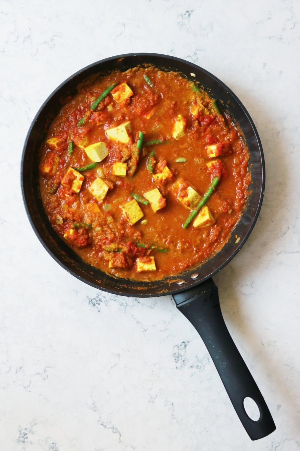 Vegan Green Bean and Tofu Curry sauce in a large frying pan