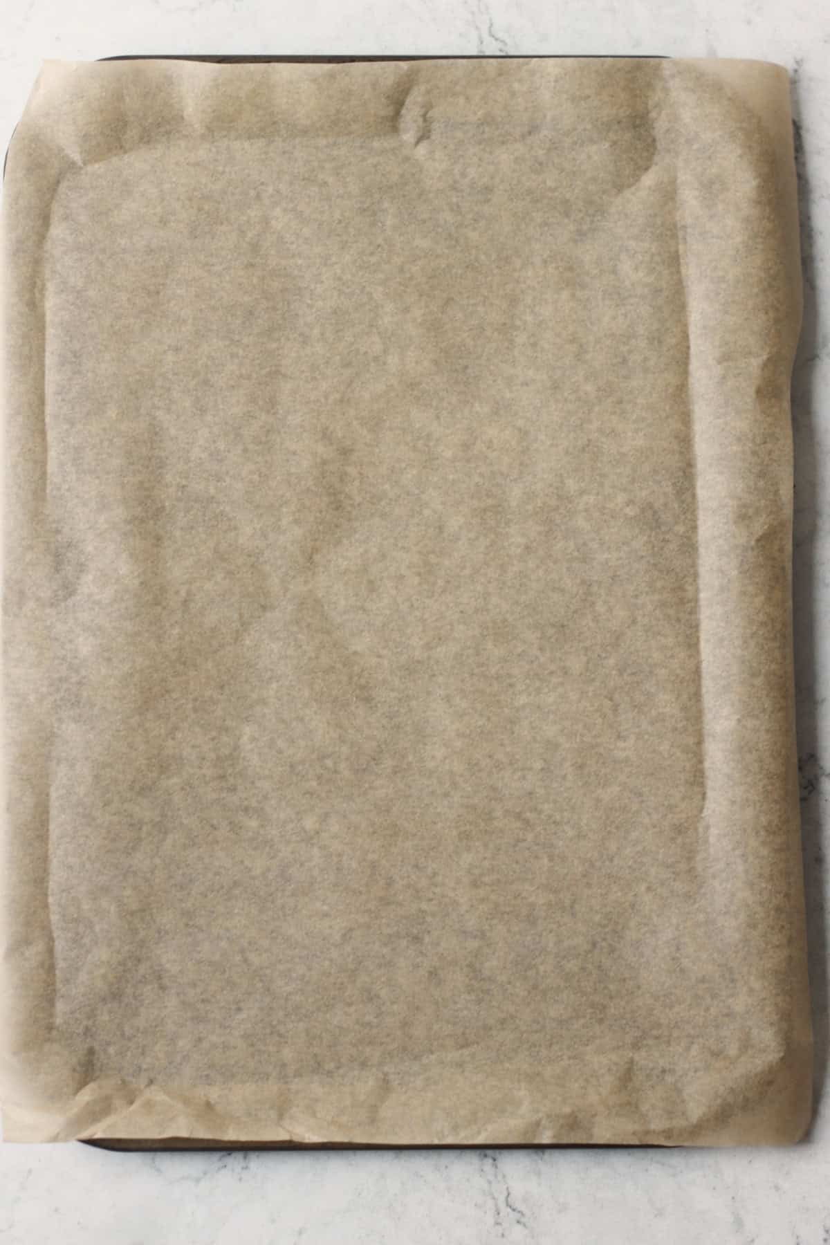 A baking tray lined with baking paper