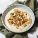 Vegan Caramelised Onion and Miso Dip on a plate topped with parsley