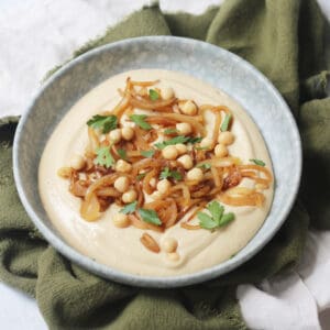 Vegan Caramelised Onion and Miso Dip on a plate topped with parsley